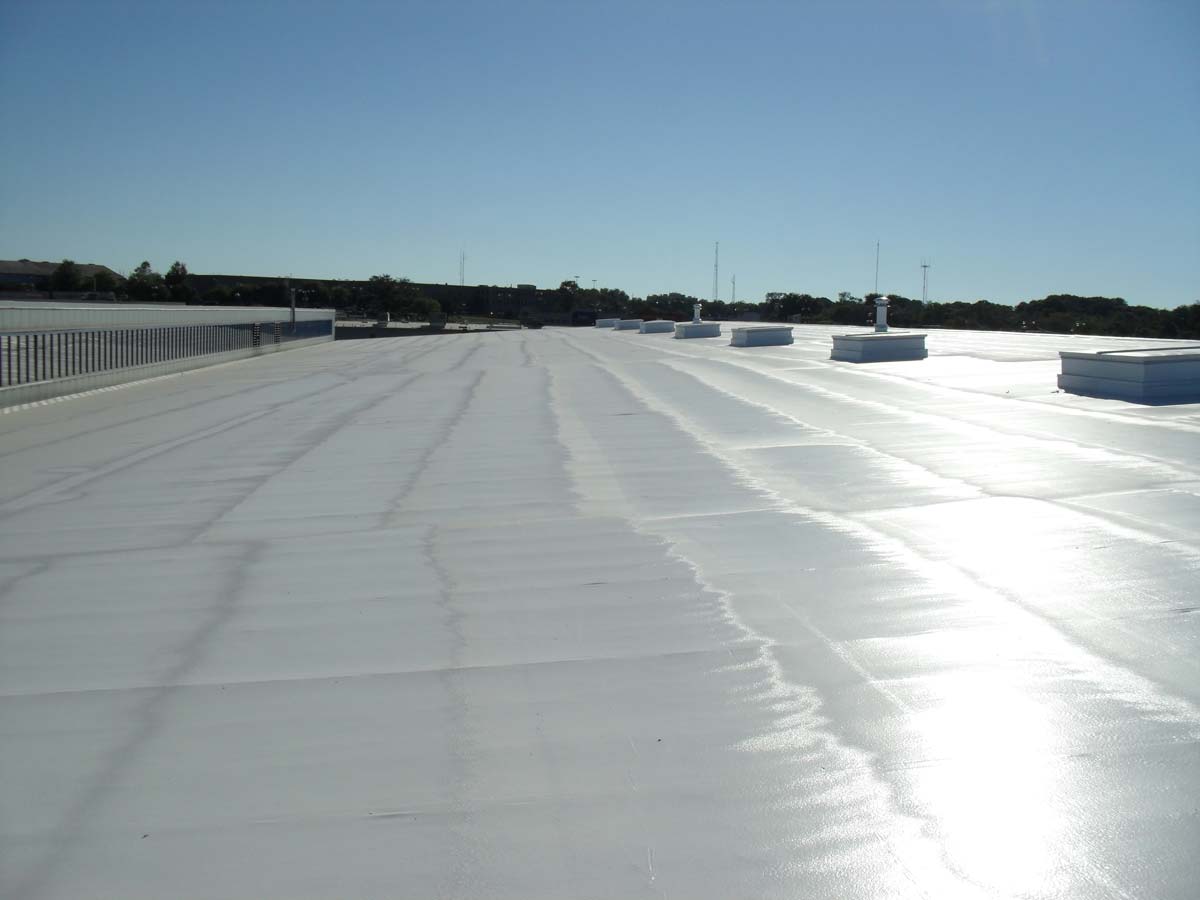 White polyurea coating on commercial roof